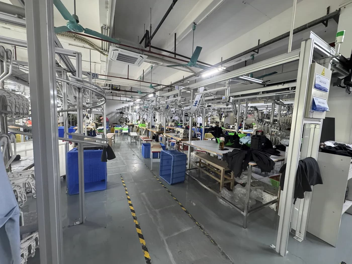 Sewing stations and overhead hanger rail inside Pindon's Dongguan factory