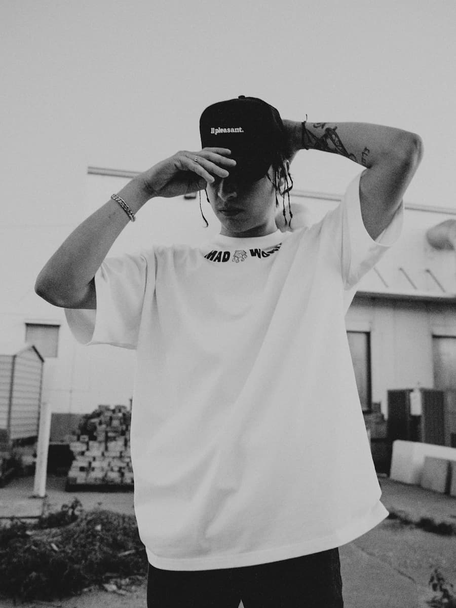 Adult model style reference — a young man with a hat on his head